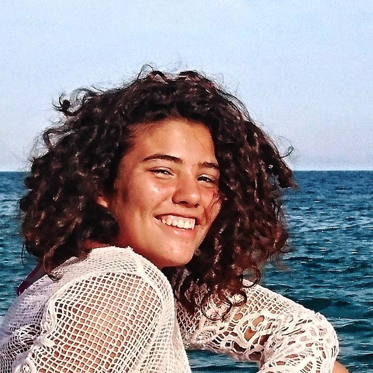 Alex Rivera, Lead Design Curator at QuietHarborFrame, reviewing corporate floral arrangements